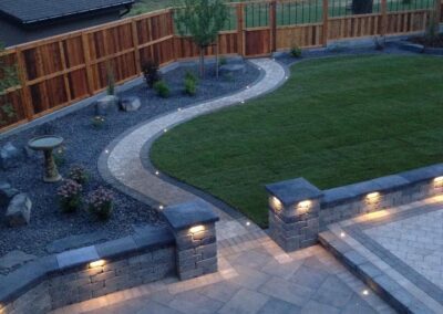 Backyard landscape lighting, paving stone patio