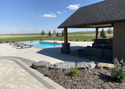 Lethbridge outdoor living space, paving stone pool patio