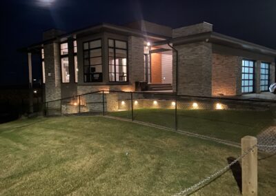 Retaining wall with landscape lighting