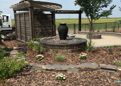 Water feature, pergola, paving stone patio