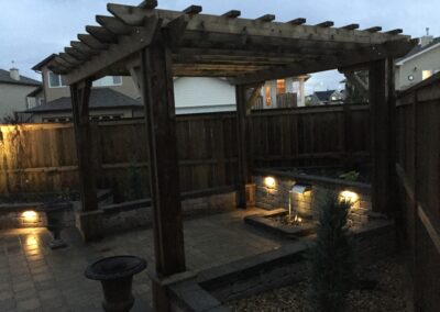 Pergola, water feature, paving stone patio