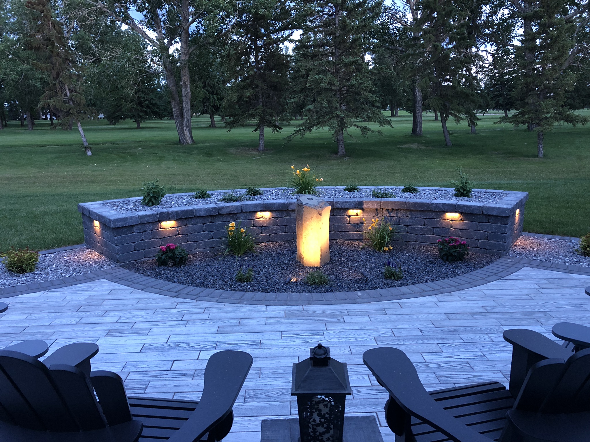 Beautiful patio and landscaping with cozy chairs