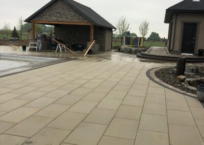 Pool house, outdoor kitchen, paving stone patio