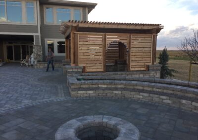 Pergola, paving stone patio, fire pit